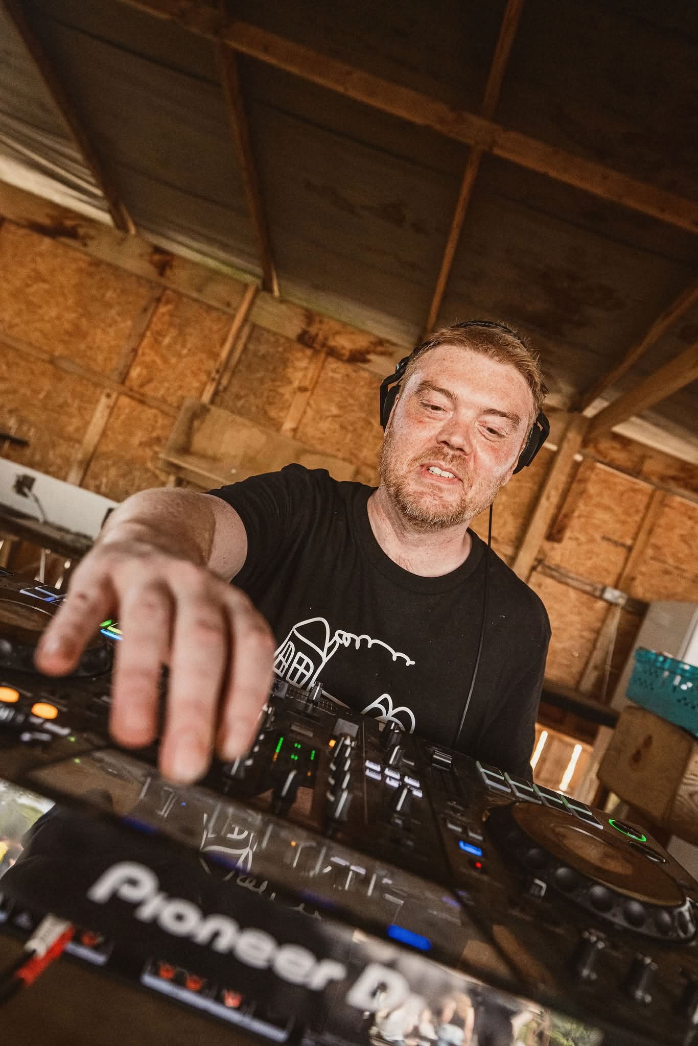 Dex behind dj deck.