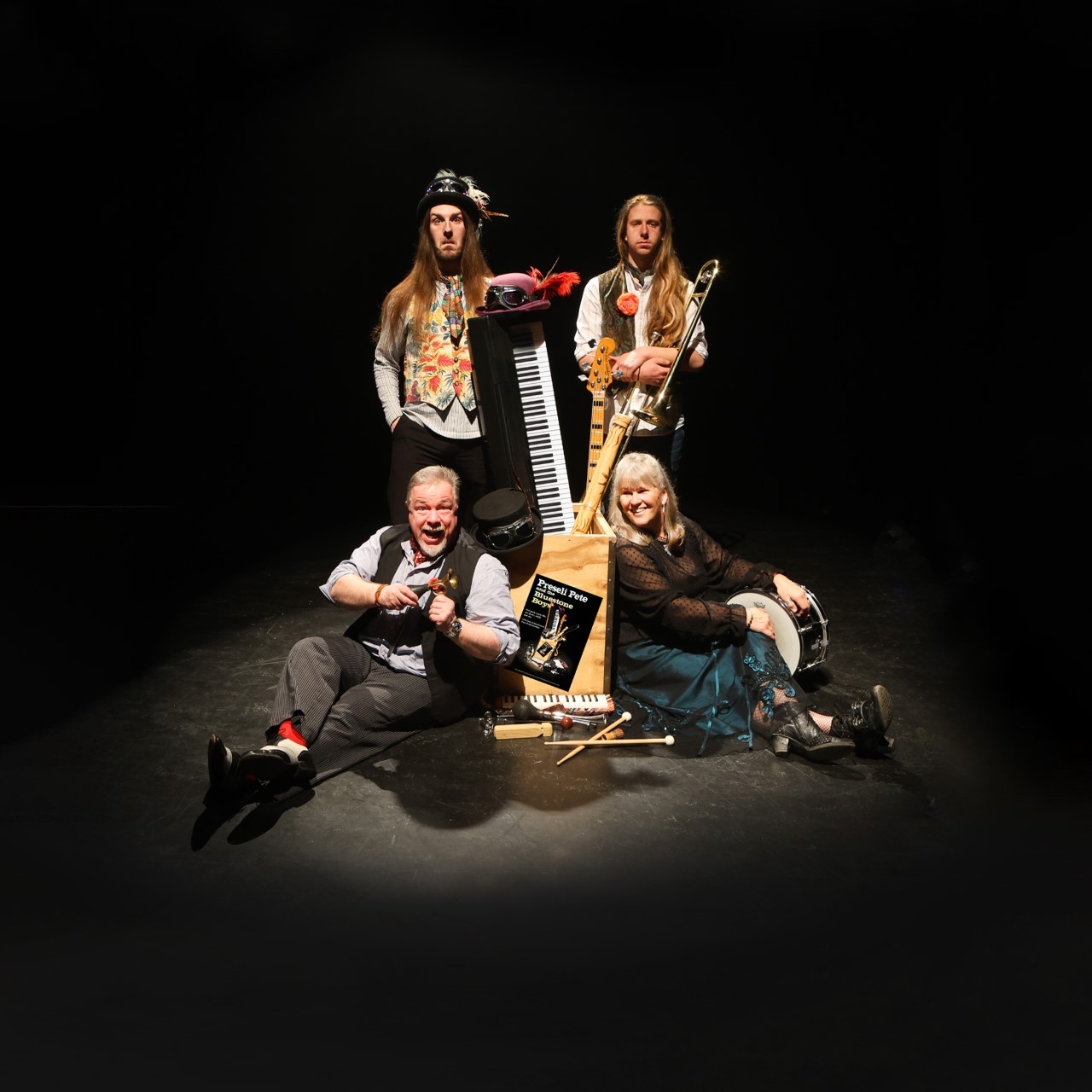 Preseli Pete & the Bluestone Boys posing onstage with their instruments.