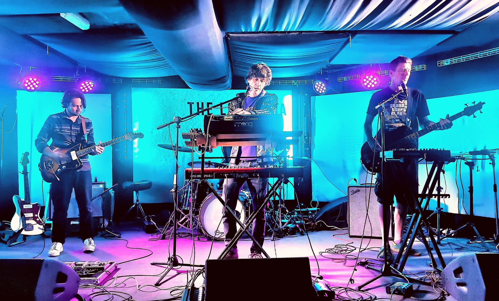 Gated Estates performing onstage.