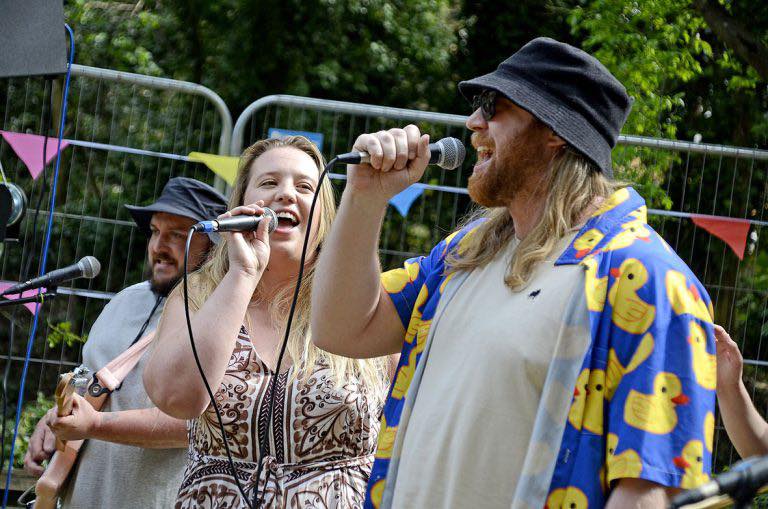 Rub-a-Dub Pub Club performing onstage.