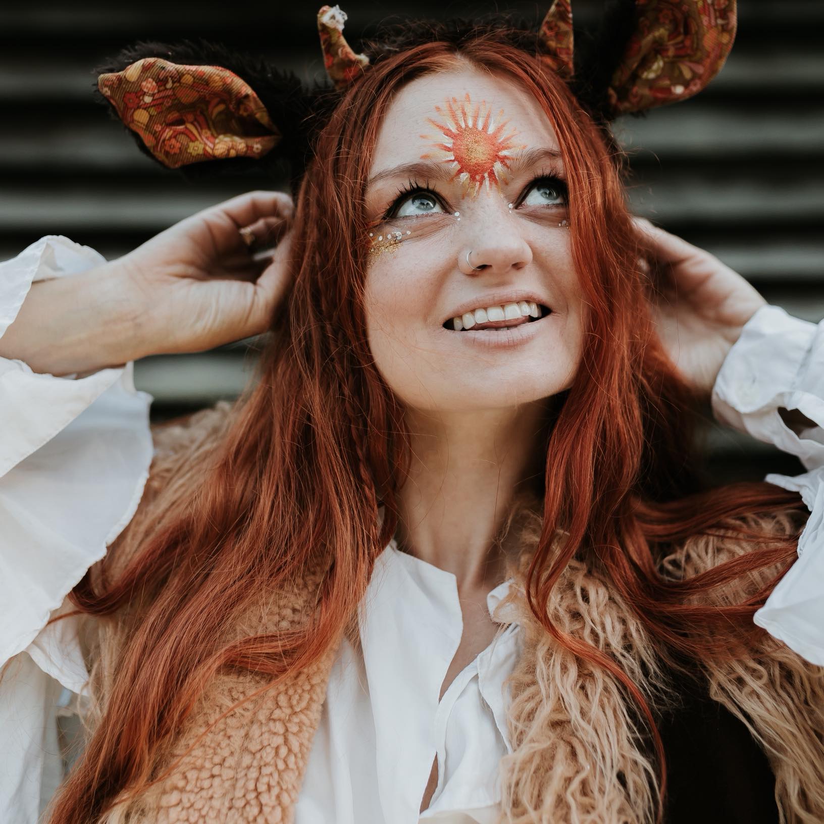 Nuala posing with a painted face and animal ears.
