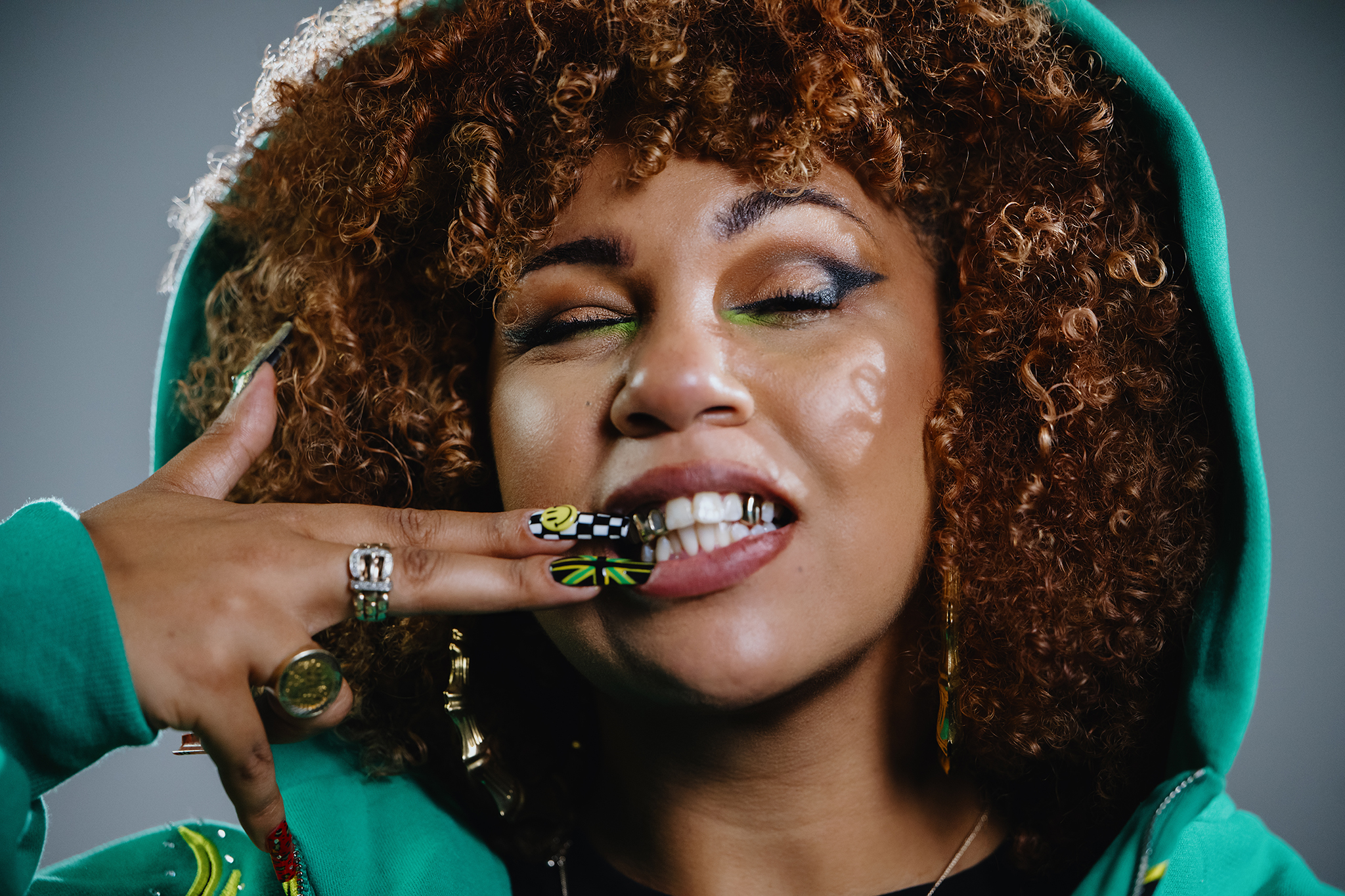 Eva Lazarus showing off her grills and nails.