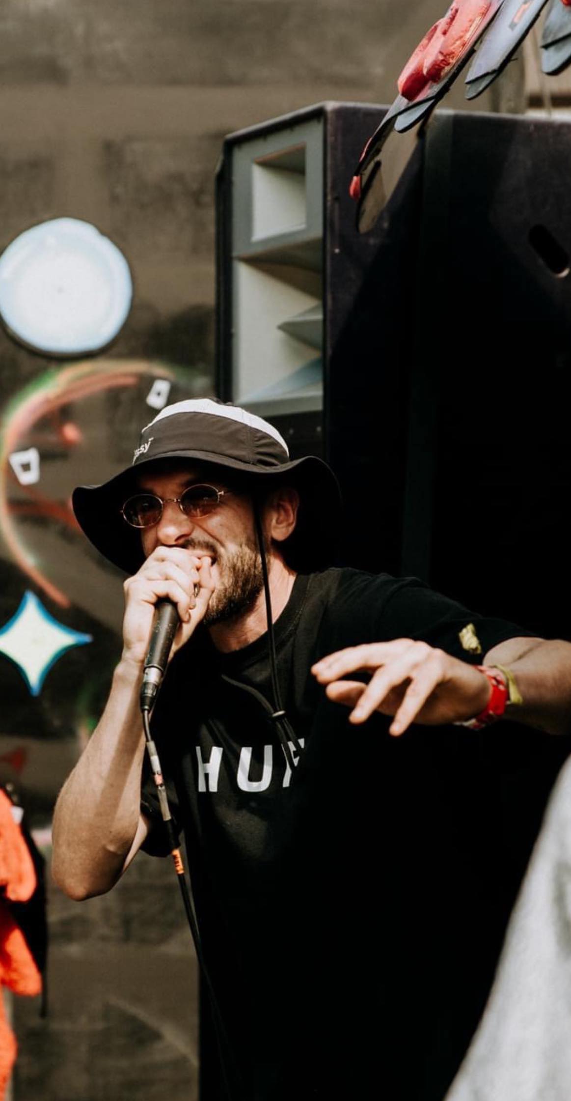 Elkay holding a mic