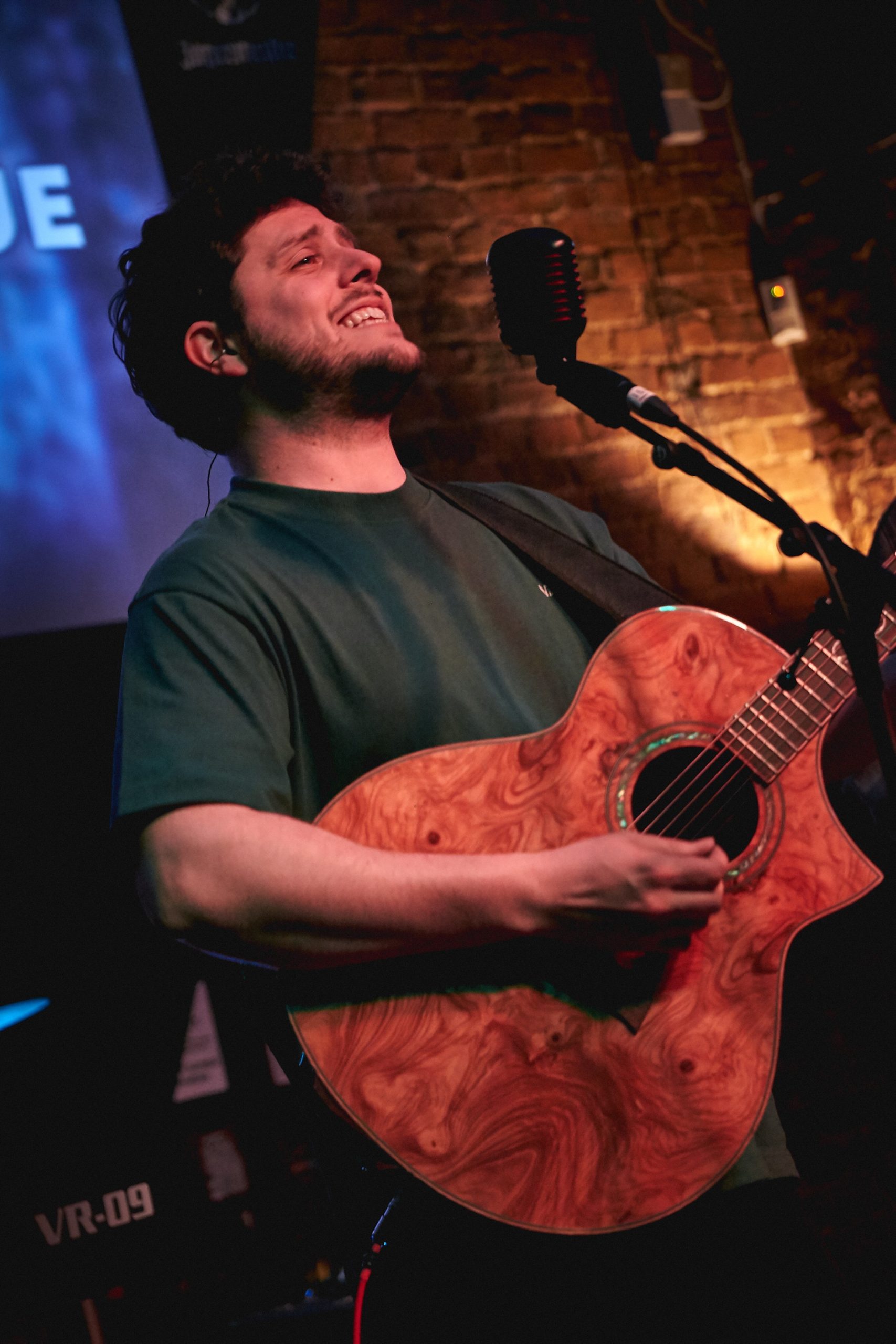 George Montague performing with his guitar