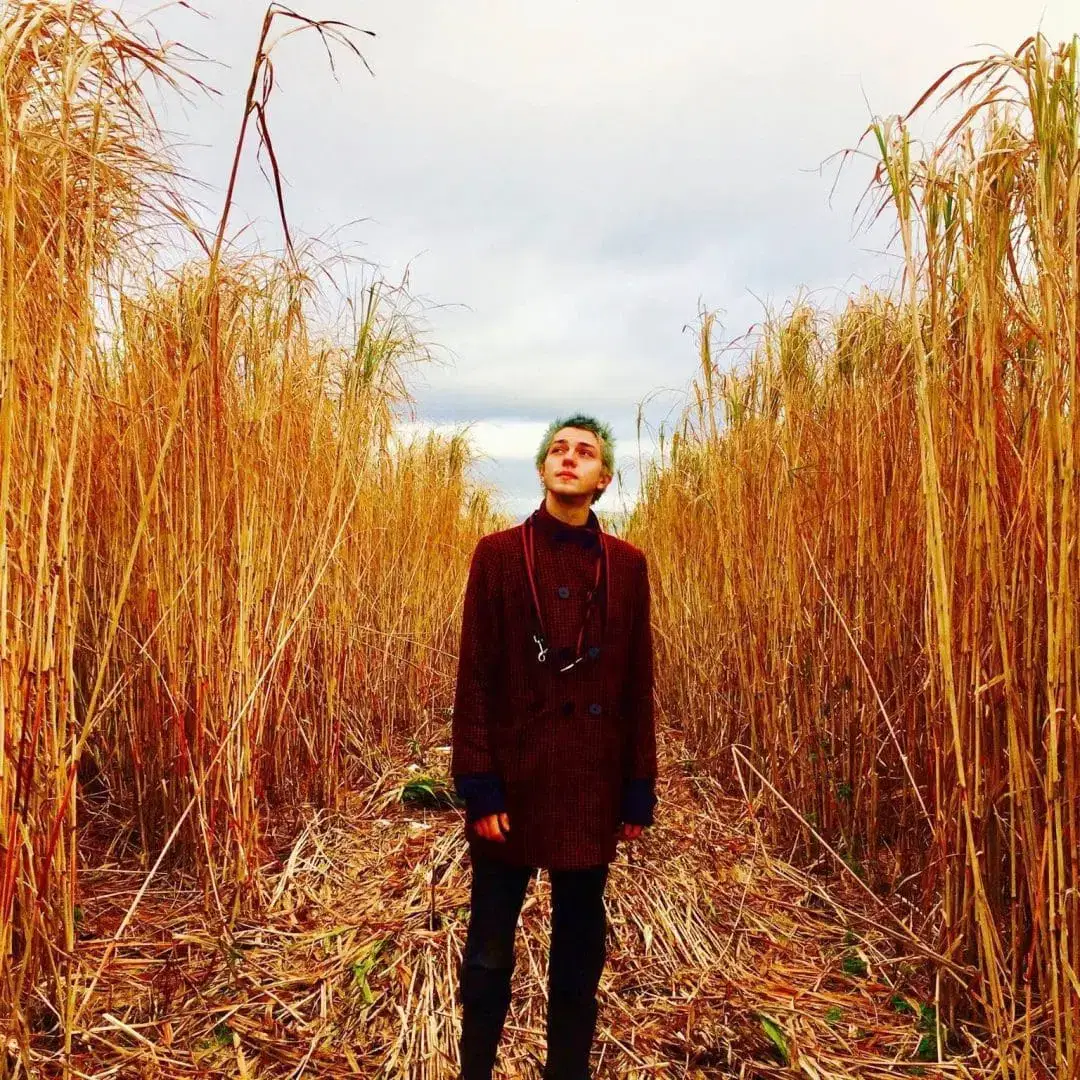 Reuben Lovett standing in a field.