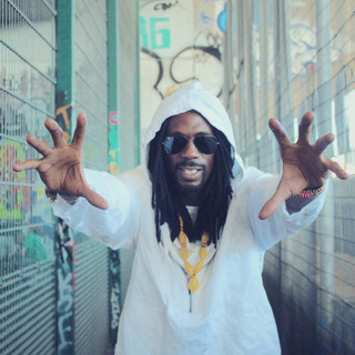 General Levy with his arms outstretched towards the camera.